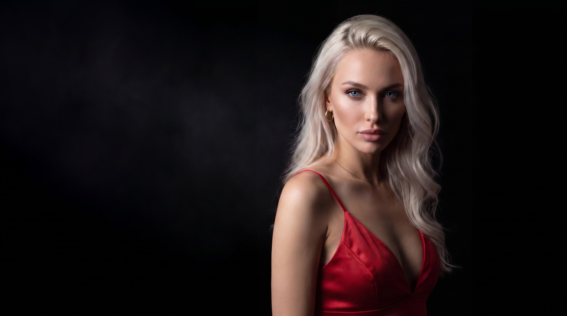 A muse in red against the dark